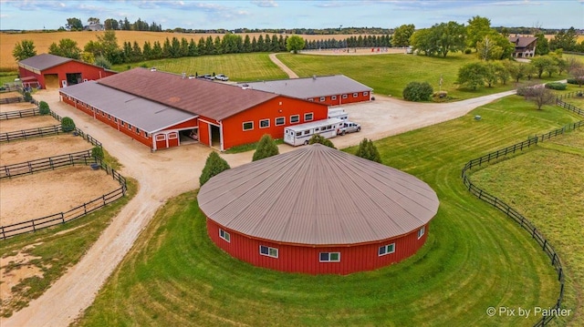 birds eye view of property featuring a rural view