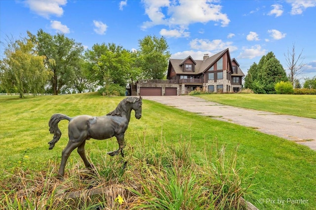 english style home with a garage and a front yard