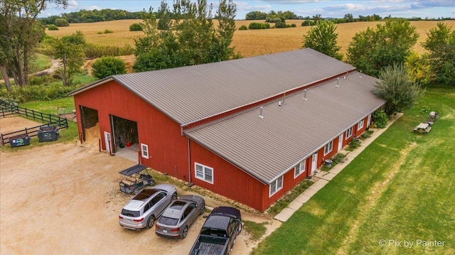 birds eye view of property featuring a rural view