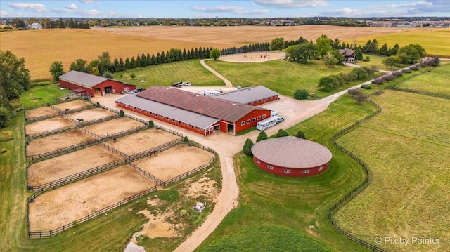 birds eye view of property with a rural view