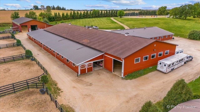 birds eye view of property with a rural view