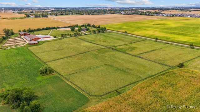 birds eye view of property featuring a rural view