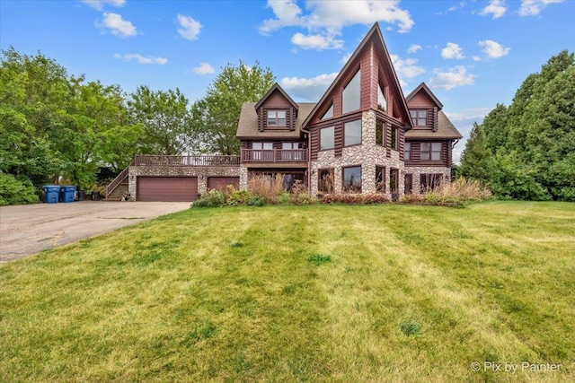 view of front of property with a wooden deck and a front yard