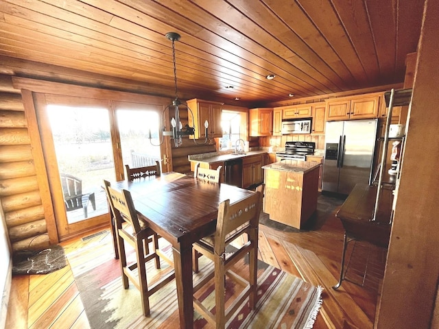 dining room featuring wooden ceiling, rustic walls, and light wood-type flooring