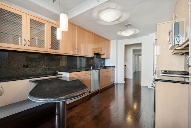 kitchen with light brown cabinetry, dark hardwood / wood-style flooring, dishwasher, pendant lighting, and backsplash