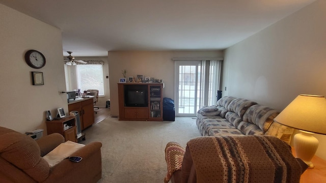 living room with light carpet and ceiling fan