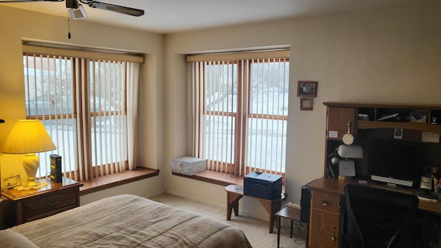 bedroom with light carpet and ceiling fan