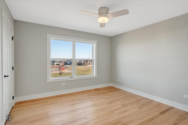 empty room featuring light hardwood / wood-style flooring and ceiling fan