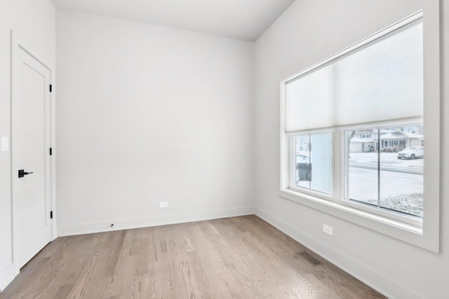 unfurnished room with light hardwood / wood-style floors