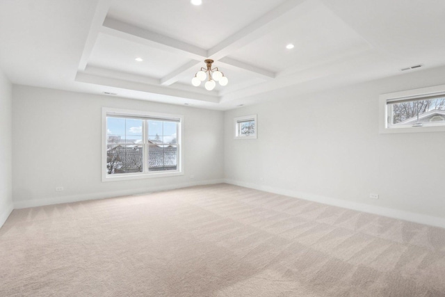 carpeted empty room with beamed ceiling, coffered ceiling, and an inviting chandelier