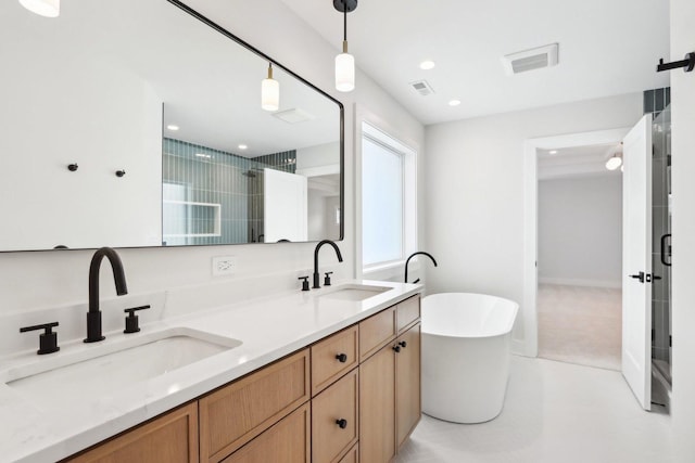 bathroom with vanity and independent shower and bath