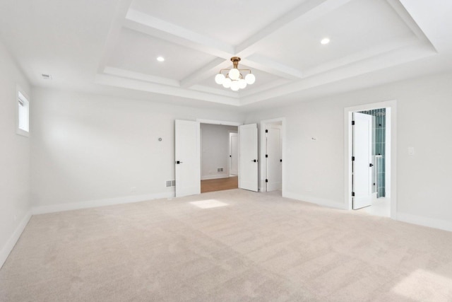 carpeted spare room featuring beamed ceiling, coffered ceiling, and a notable chandelier