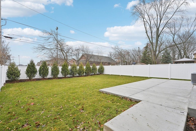 view of yard featuring a patio area and central air condition unit