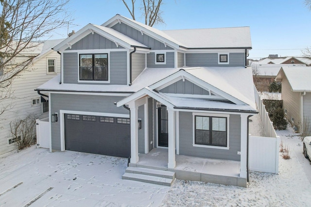 view of front of property featuring a garage and covered porch