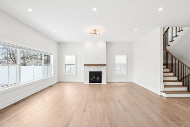 unfurnished living room featuring light wood-type flooring