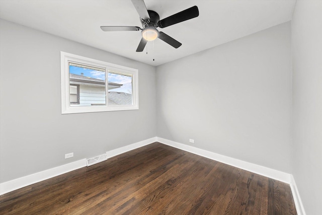 empty room with hardwood / wood-style flooring and ceiling fan