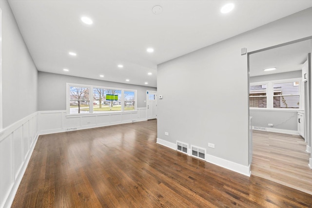 unfurnished living room featuring hardwood / wood-style floors