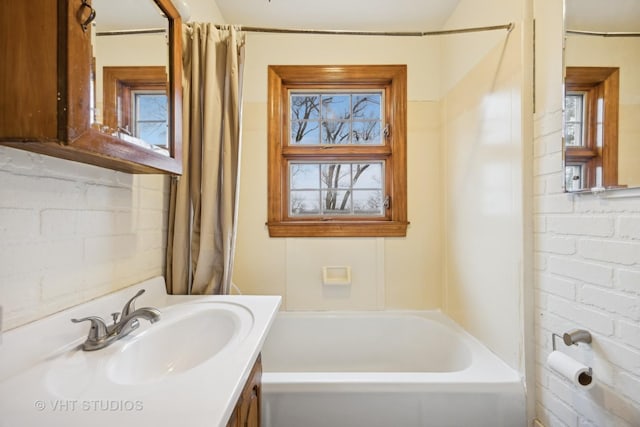 bathroom with vanity and shower / bath combination with curtain