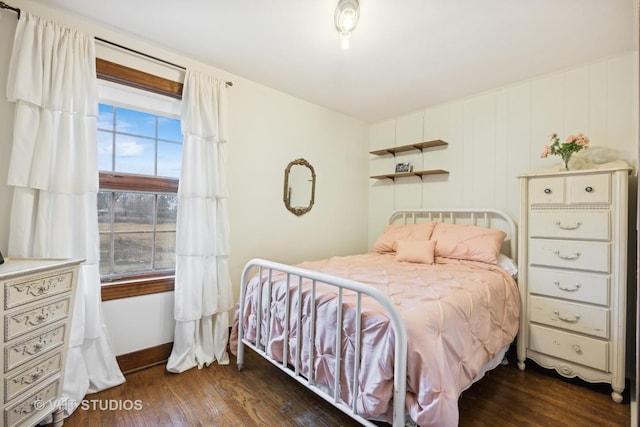 bedroom featuring dark hardwood / wood-style floors