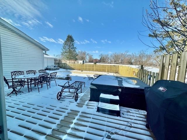 snow covered deck featuring grilling area