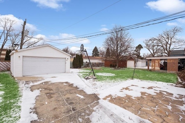 view of front facade with a garage, an outbuilding, and a front yard