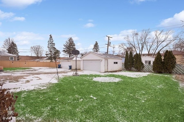 view of yard featuring a garage and an outdoor structure