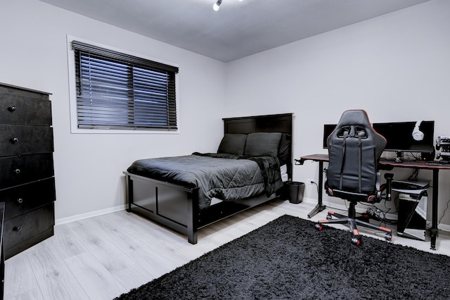 bedroom with light hardwood / wood-style floors