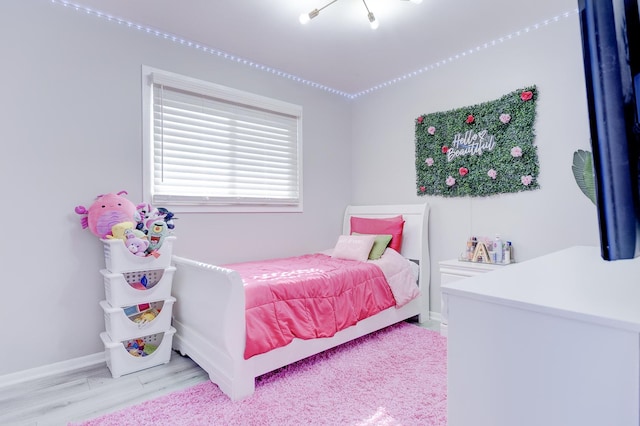 bedroom featuring light wood-type flooring