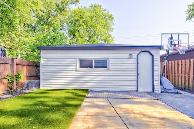 view of outbuilding featuring a lawn