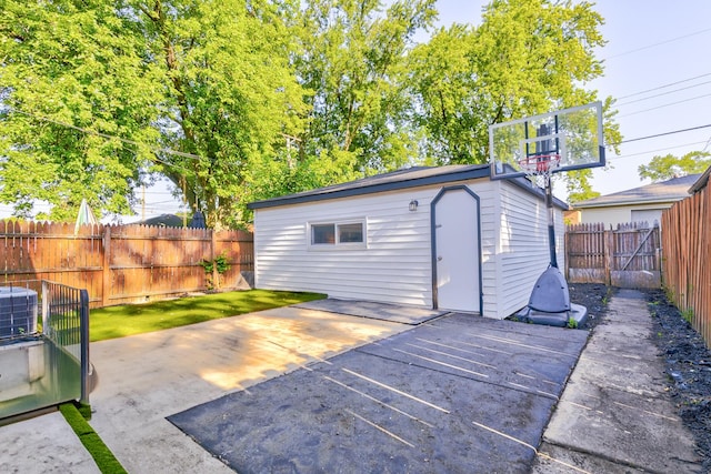 view of patio featuring a shed