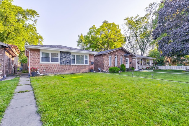 ranch-style house featuring a front lawn