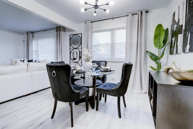 dining room with an inviting chandelier and light hardwood / wood-style floors