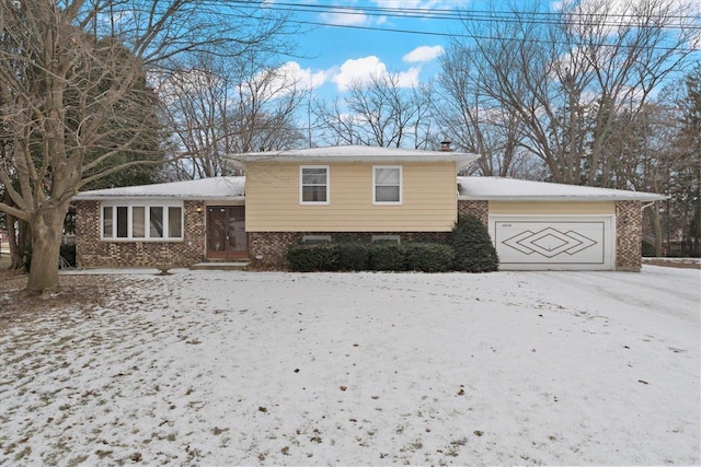 split level home with a garage