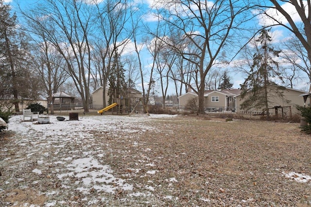 snowy yard with a playground