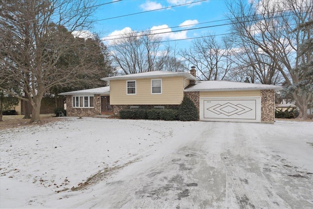 split level home featuring a garage