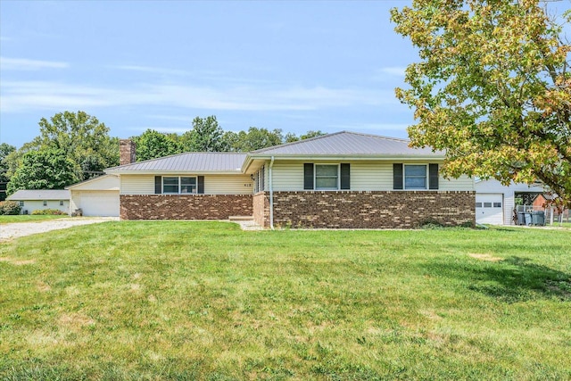 ranch-style house featuring a garage and a front yard