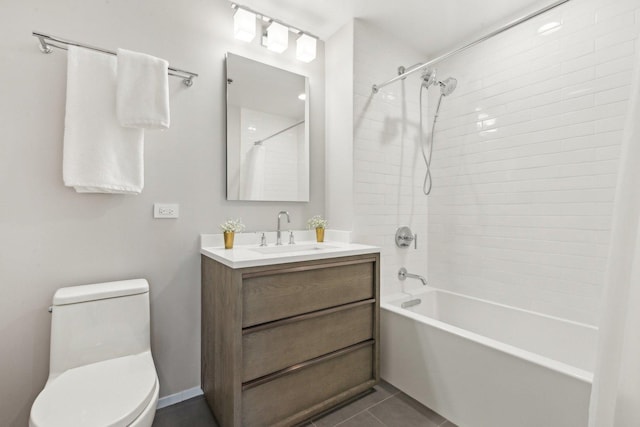 full bathroom featuring tiled shower / bath combo, vanity, tile patterned floors, and toilet