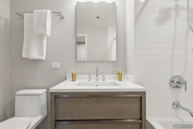 full bathroom with vanity, toilet, and tiled shower / bath combo