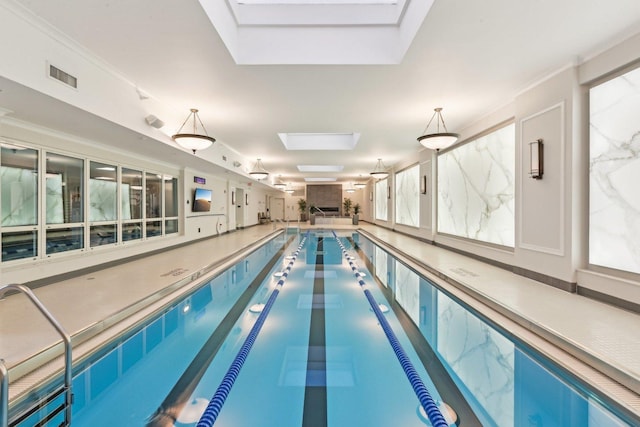 view of pool featuring a skylight