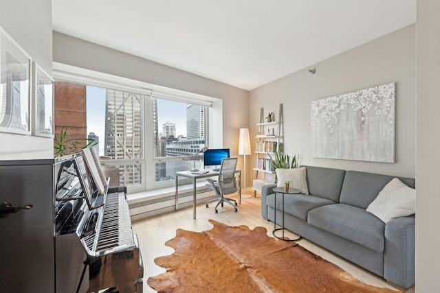 living room featuring a baseboard radiator and light hardwood / wood-style floors