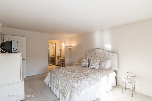 bedroom with light colored carpet