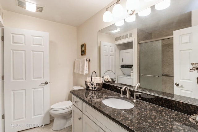 bathroom with vanity, toilet, an enclosed shower, and tile patterned flooring