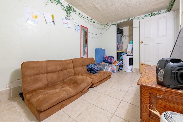 living room featuring tile patterned flooring and a textured ceiling