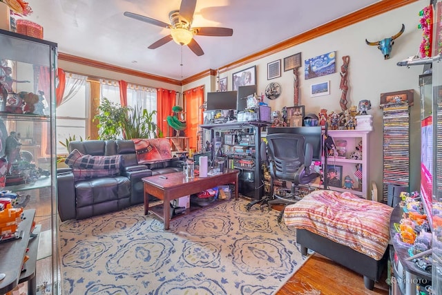 living room with ornamental molding and ceiling fan