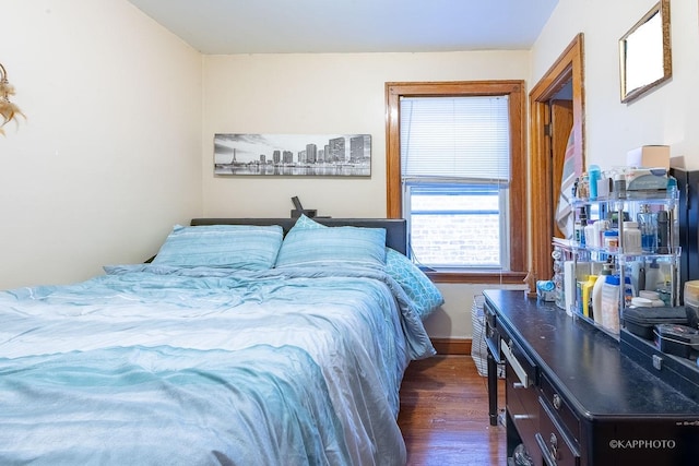 bedroom featuring dark wood-style floors