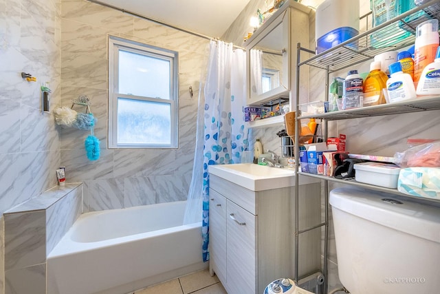 full bathroom with tile patterned floors, toilet, tile walls, vanity, and shower / bath combination with curtain