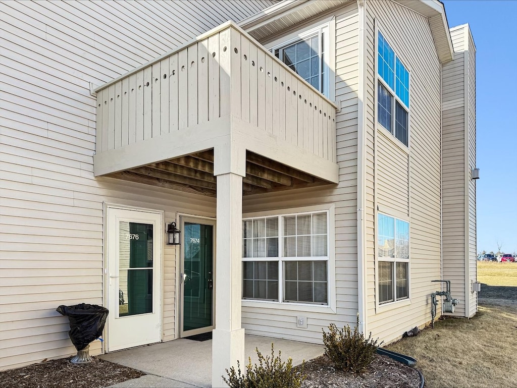 exterior space with a balcony and a patio area