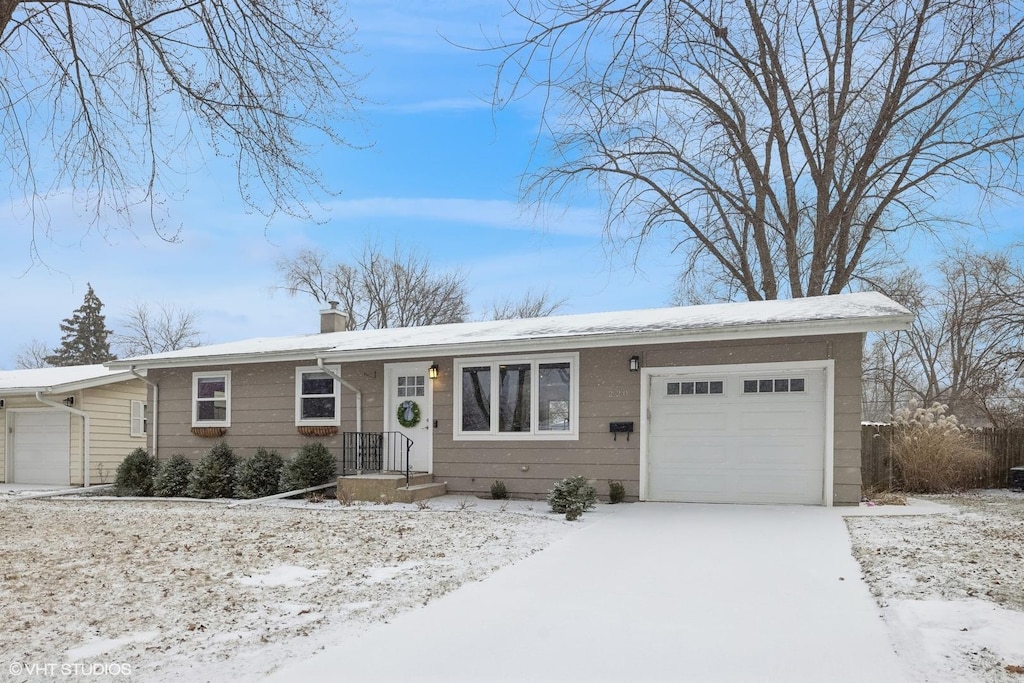 ranch-style house featuring a garage