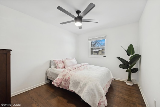 bedroom with dark wood-type flooring and ceiling fan