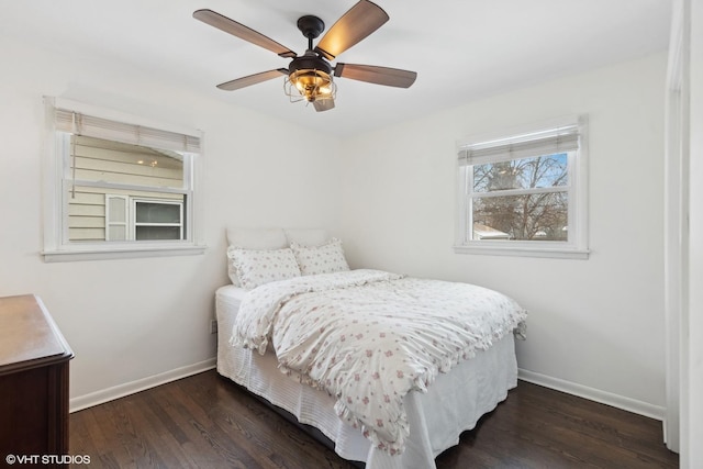 bedroom with dark wood-type flooring and ceiling fan